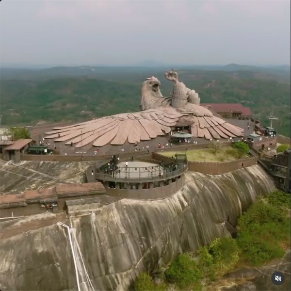 Aerial view of the monumental Jatayu sculpture on its rocky hill in Kerala