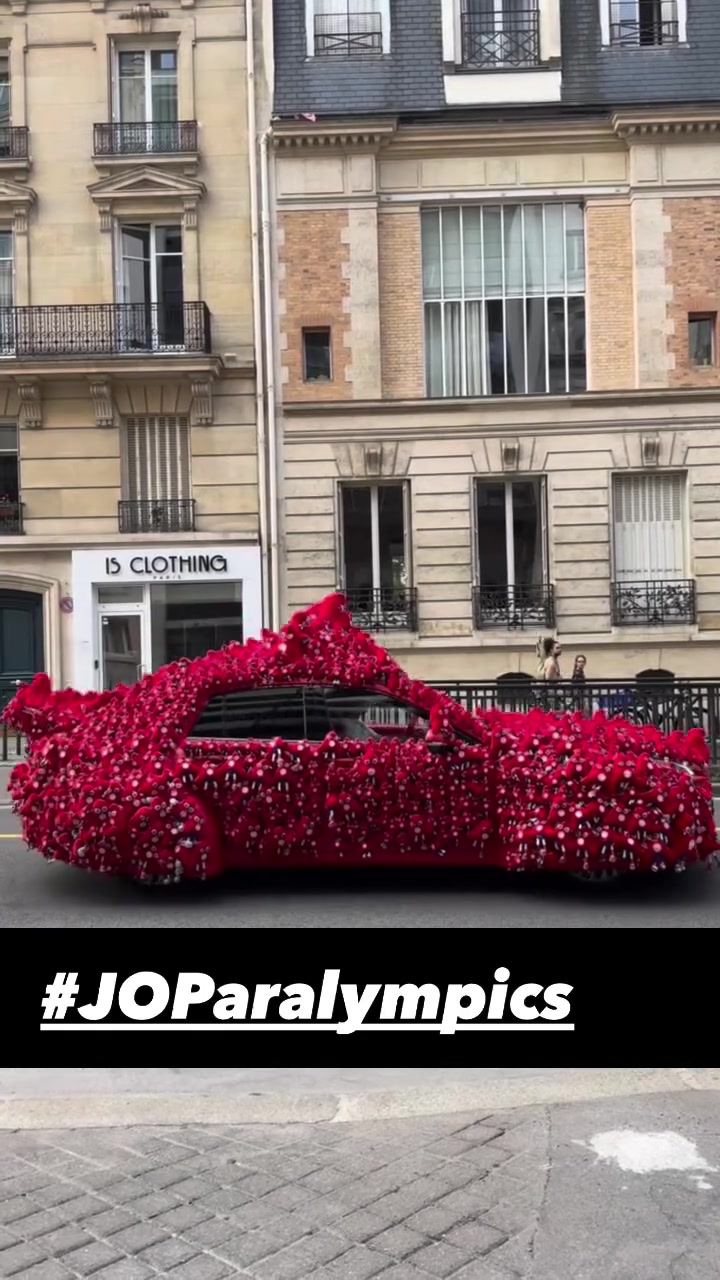 Decorated red car during the Paris Paralympic Games opening ceremony