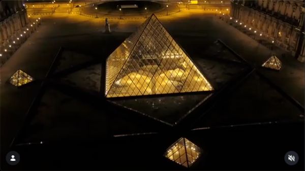 The illuminated Louvre pyramid and Cour Napoléon, seen at night