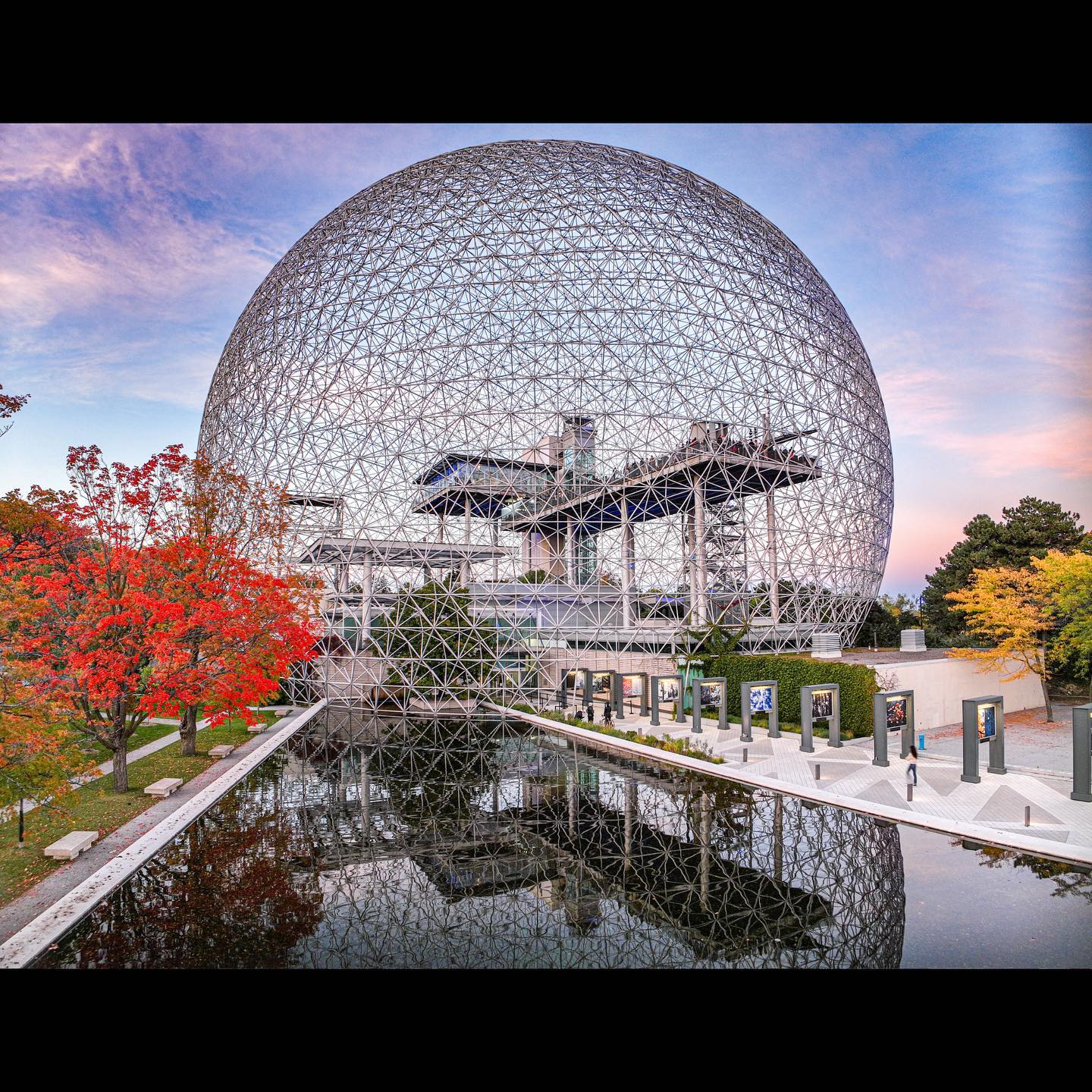 The geodesic dome of Montreal’s Biosphere beside its pool