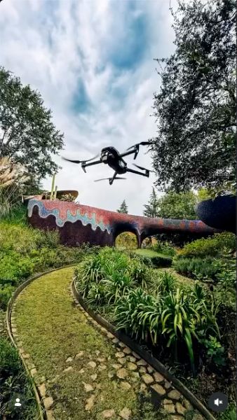 Drone flying above a garden in preparation images from the Tame Impala project