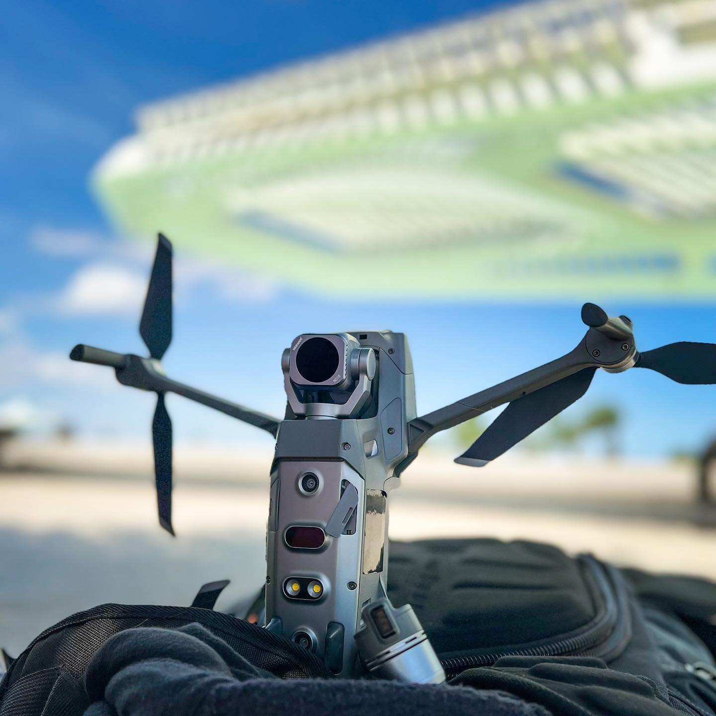 Drone resting on its equipment, with the coastline behind it, during preparations for the Vintage Culture project
